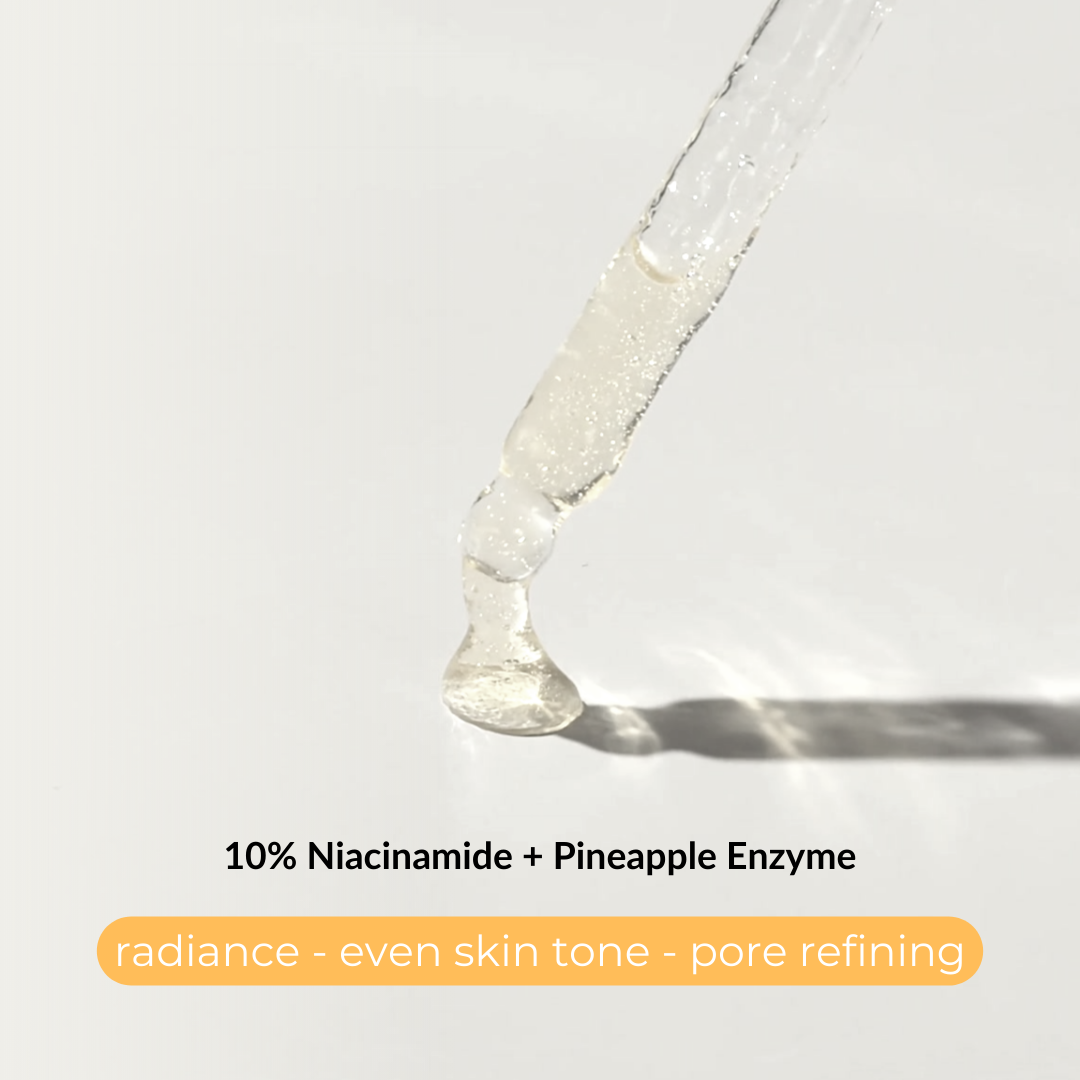 Brightening complex serum dropping to. show the texture. 10% Niacinamide + Pineapple Enzyme for radiance, even skin tone and pore refining.