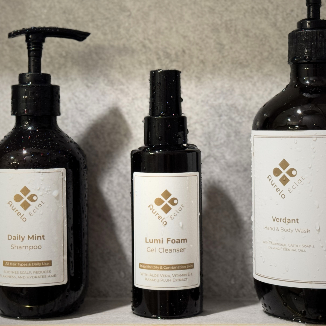 Lumi Foam Gel Cleanser: Image of Lumi Foam Gel Cleanser on a bathroom shelf next to other Aurelo Eclat products.